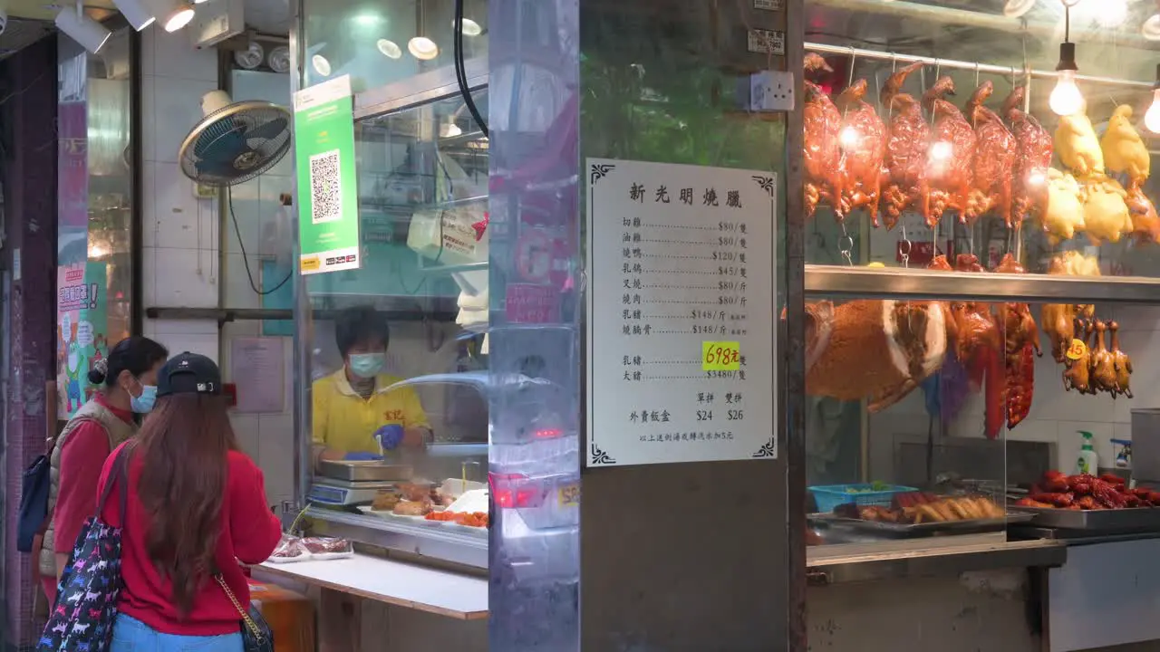 Residents buy lunch meals from a Hong Kong-style barbeque food restaurant in Hong Kong