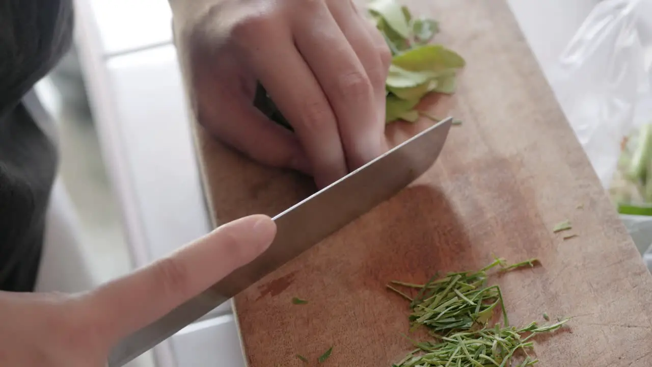 using knife chopping bergamot leaves prepare for asia cuisine cooking