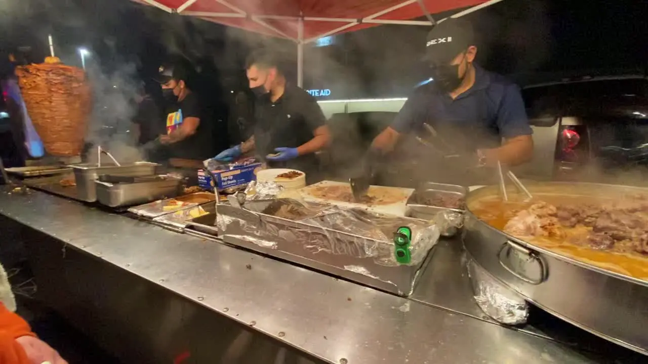 Street food people cooking mexican tacos al pastor meat