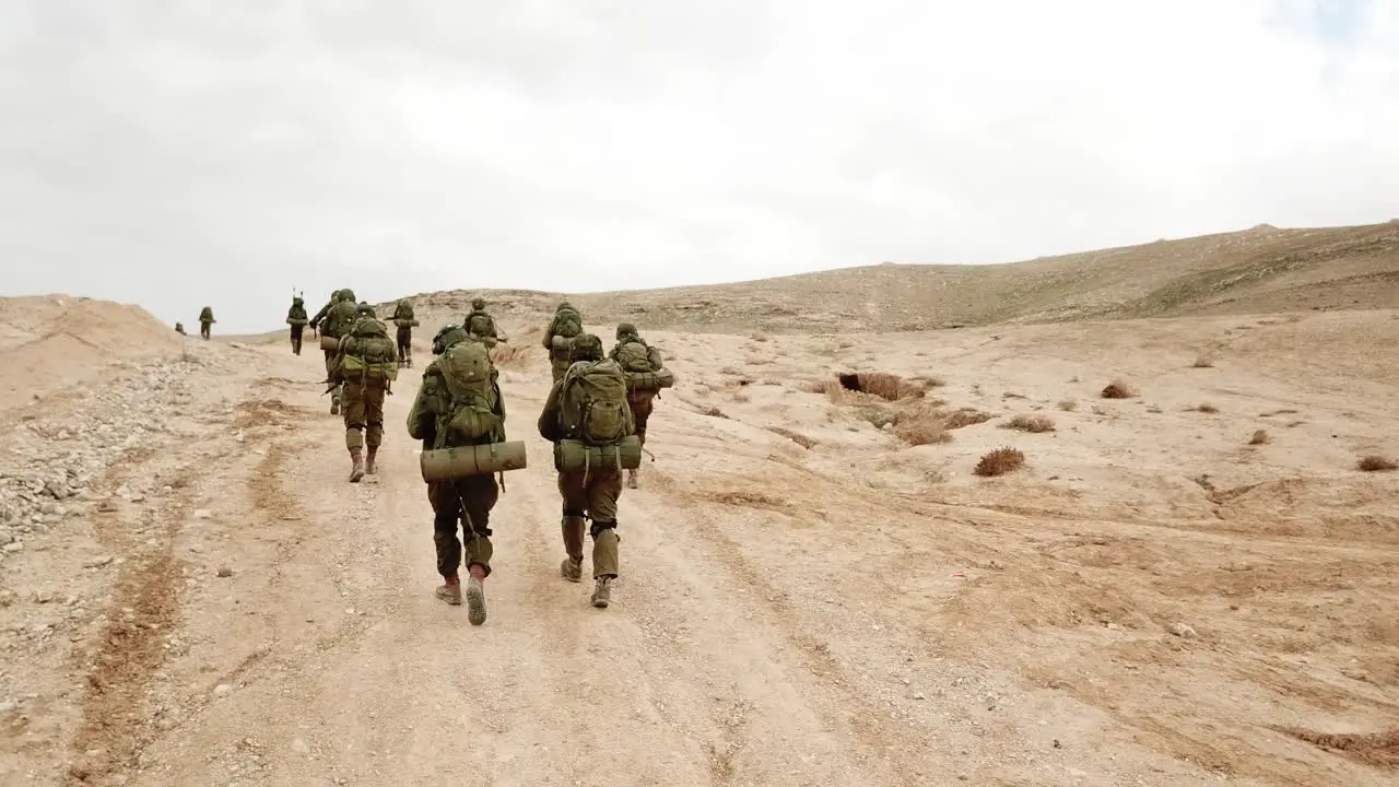 IDF Soldier from Israel Walking During Military Operation in Desert