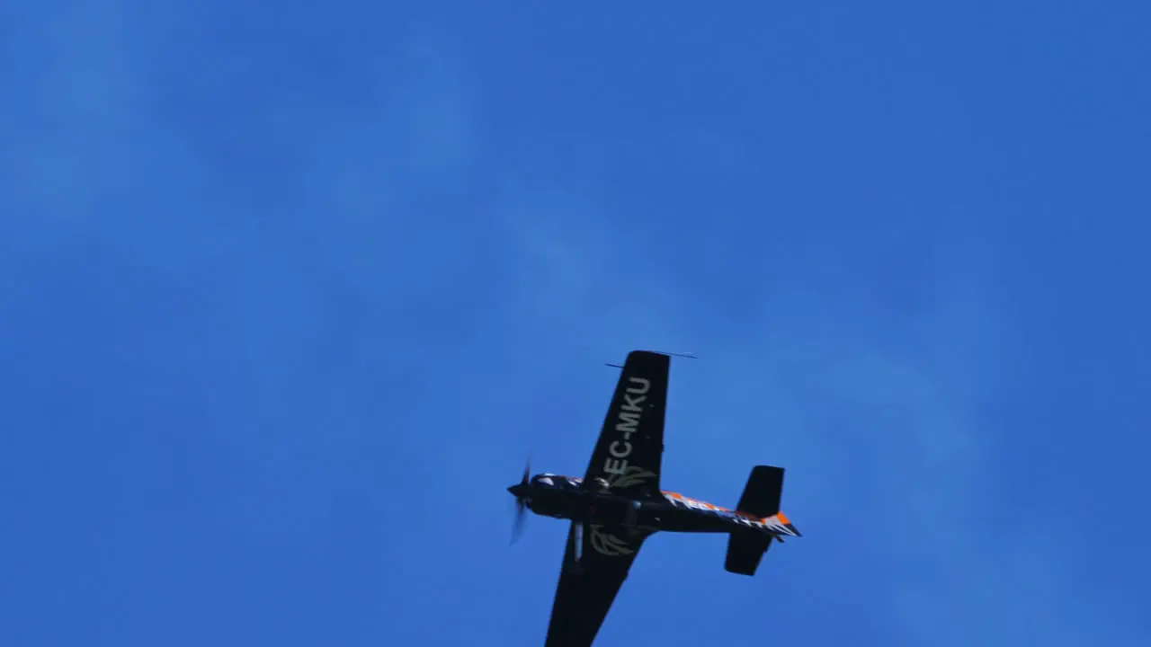 Thiene Vicenza Italy- October 16th 2021 The Sukhoi Su-31 flies through the air with white smoke billowing white over the blue sky