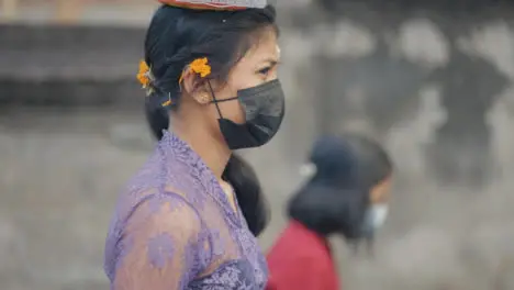 Tracking Shot of a Woman Carrying Things Through Bali