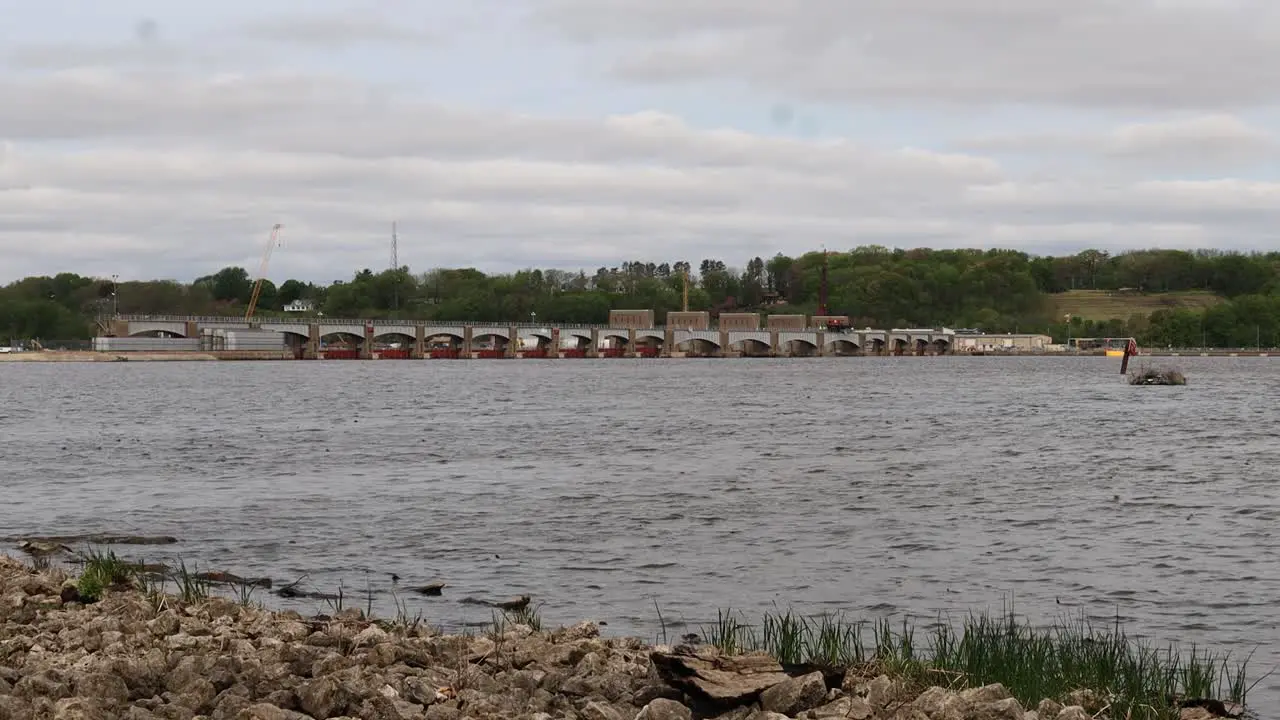 View of Lock and Dam 14 on the Mississippi River on a cloudy spring day near LeClair Iowa looping