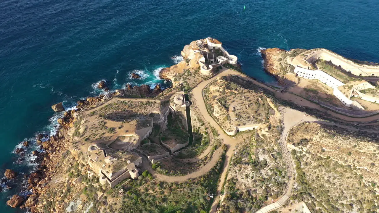 Fortress on a rocky foothill Cartagena Spain aerial view military battery sunny