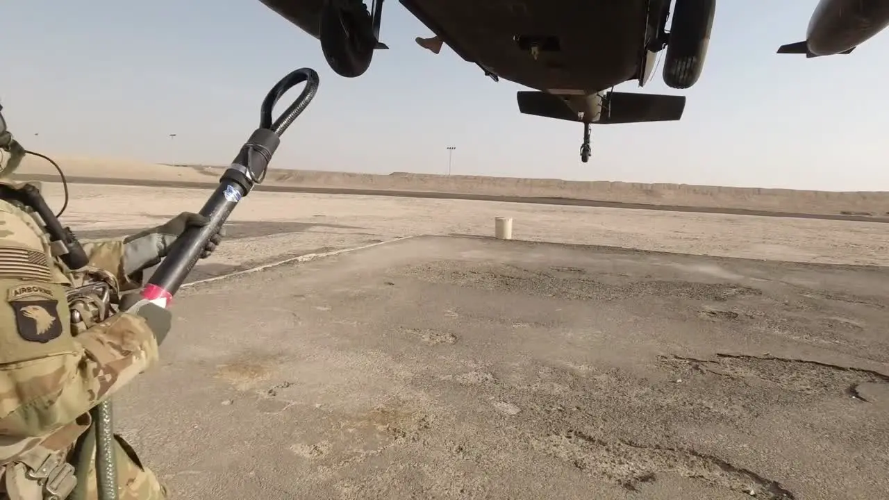 Us Army 28Th Expeditionary Combat Aviation Brigade Soldiers And Simulated Load Onto Uh-60 Black Hawk Kuwait