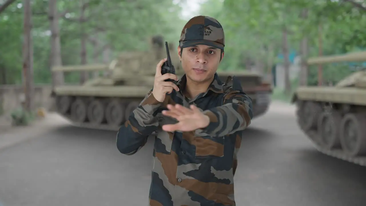 Indian army man giving instructions on walkie talkie