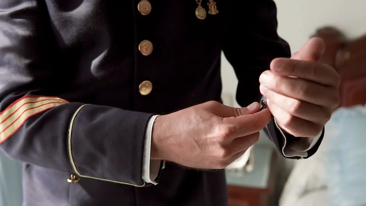 Gentleman Wearing Navy Blue Military Uniform Fixing Watch On His Wrist