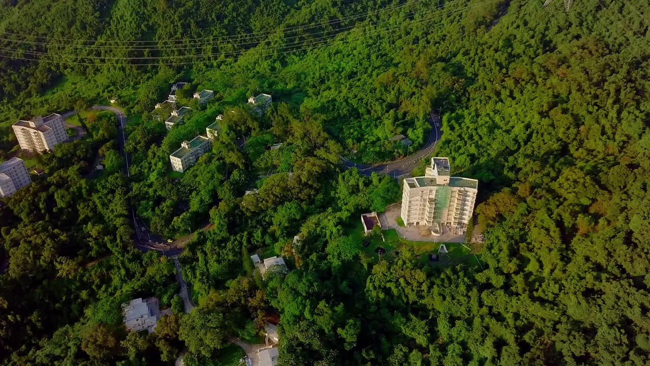 Aerial View of Mountain Road and Buildings On Side of Hong Kong Tallest Peak Tai Mo Shan Mountain