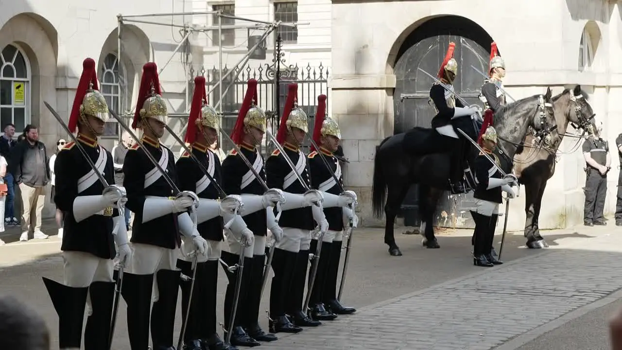 london guards in a line awaiting the next steps