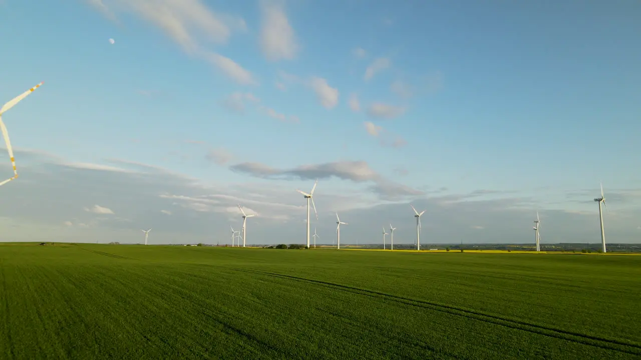 Windmill farm creating green energy renewable resource climate change