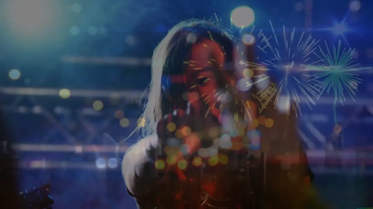 Animation of light spots and fireworks over caucasian woman singing