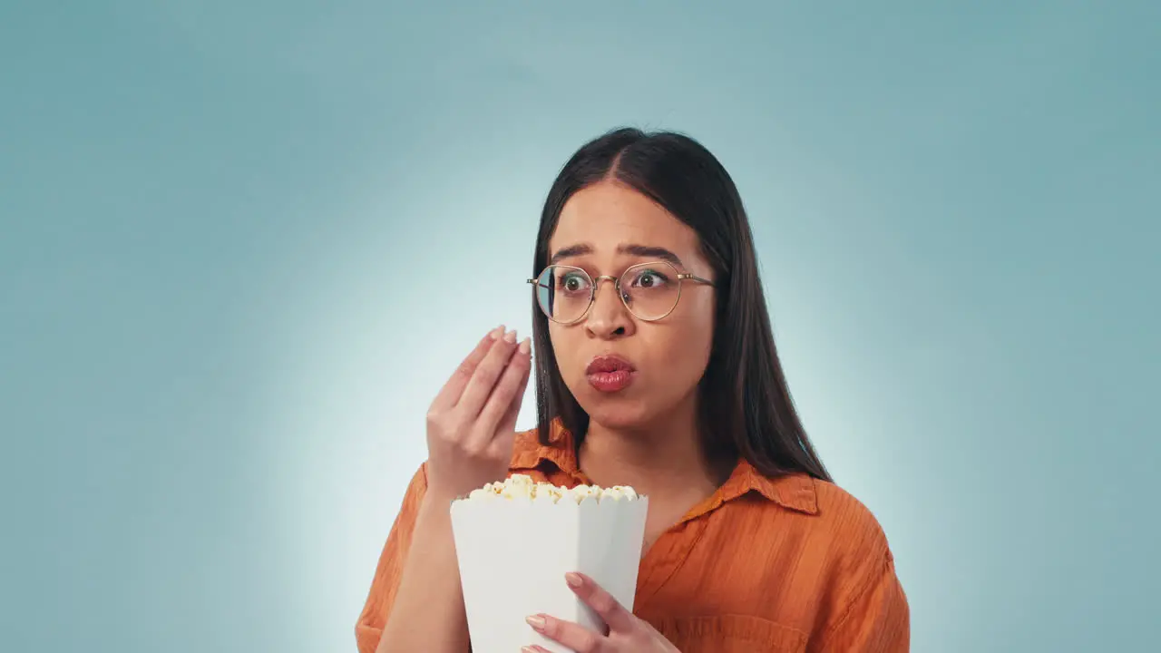 Face popcorn and a woman watching tv