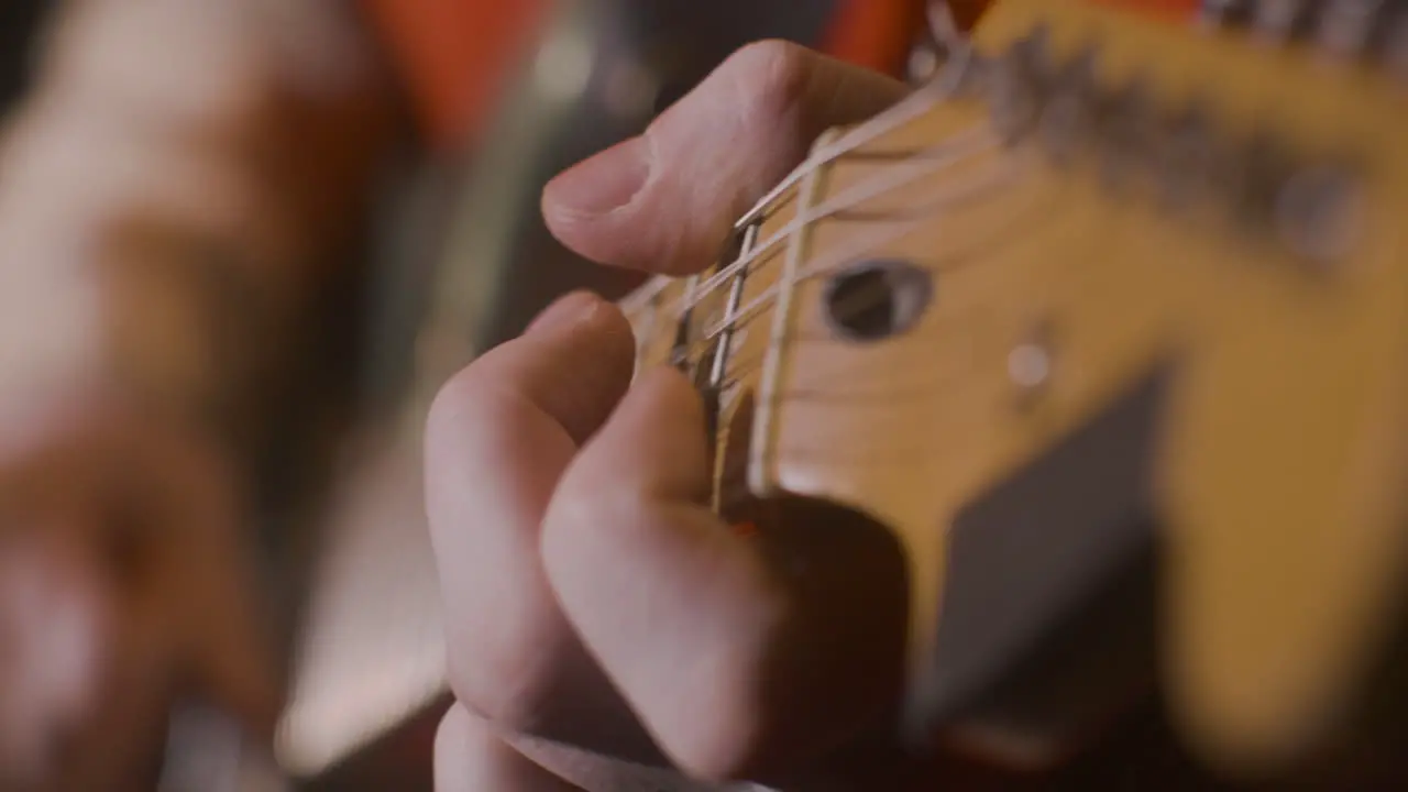 Close Up Of An Unrecognizable Male Musician Playing Guitar 1