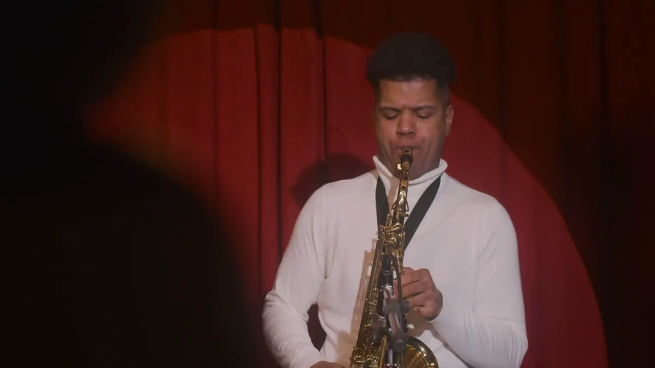 Latin Man Playing Sax During Live Music Perfomance 2