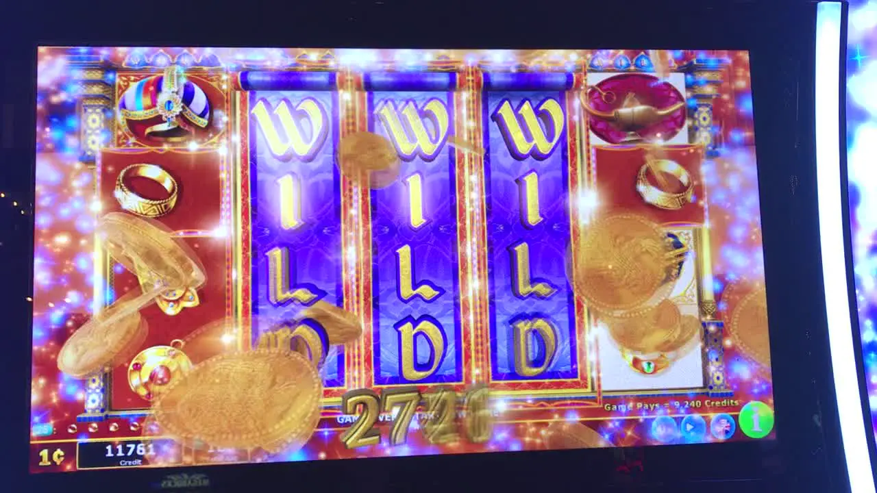 A winning slot machine hitting a WILD WILD WILD on the center of the screen