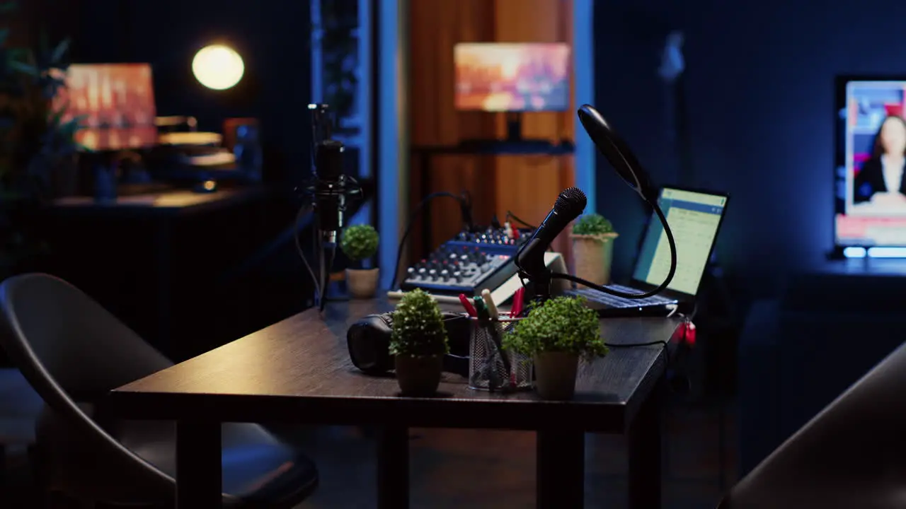 Empty desk in home production studio with podcast equipment technology