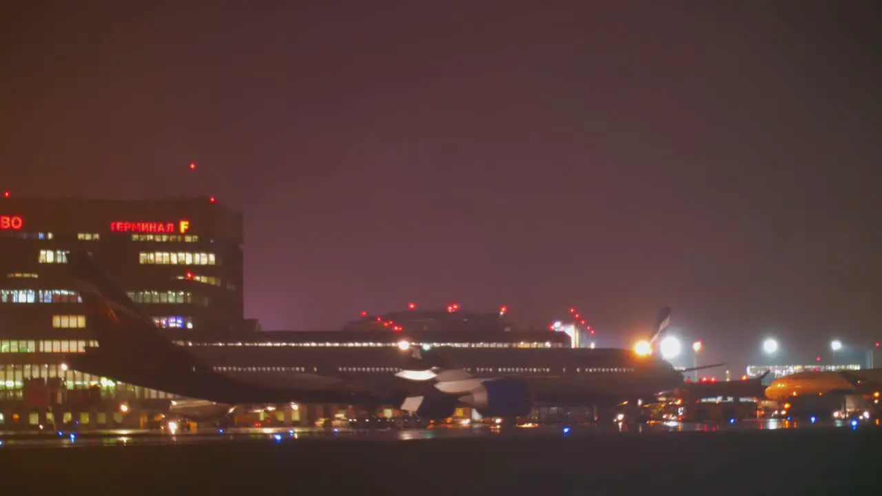 Aeroflot aircraft and Terminal F of Sheremetyevo Airport night view Moscow