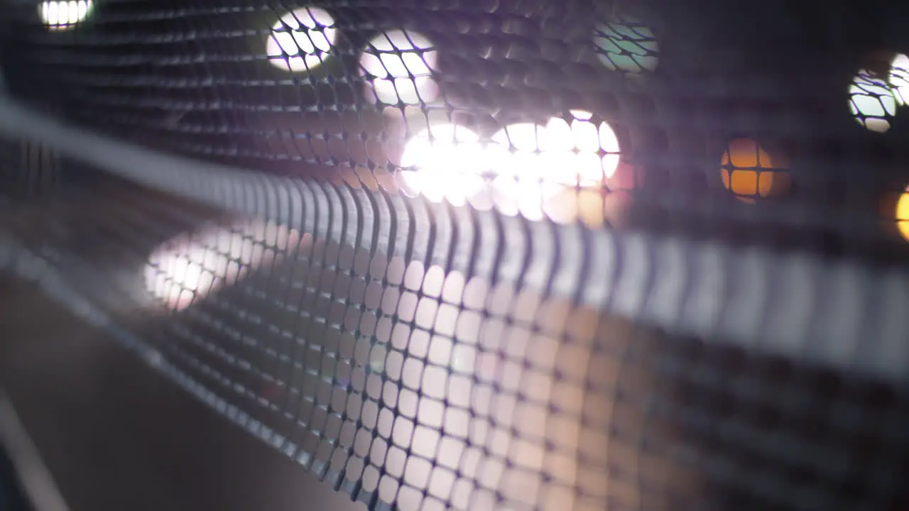 Cars driving at night view through the net