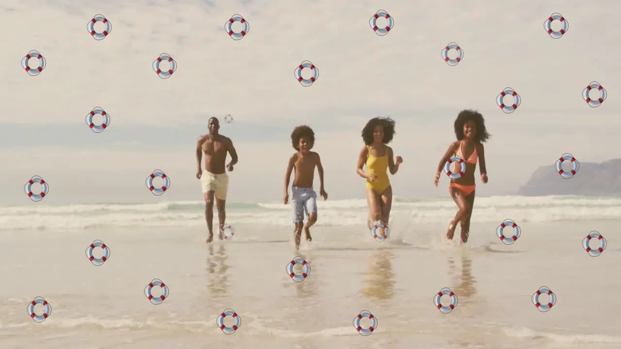 Animation of life buoys over happy african american parents and children running from sea to beach