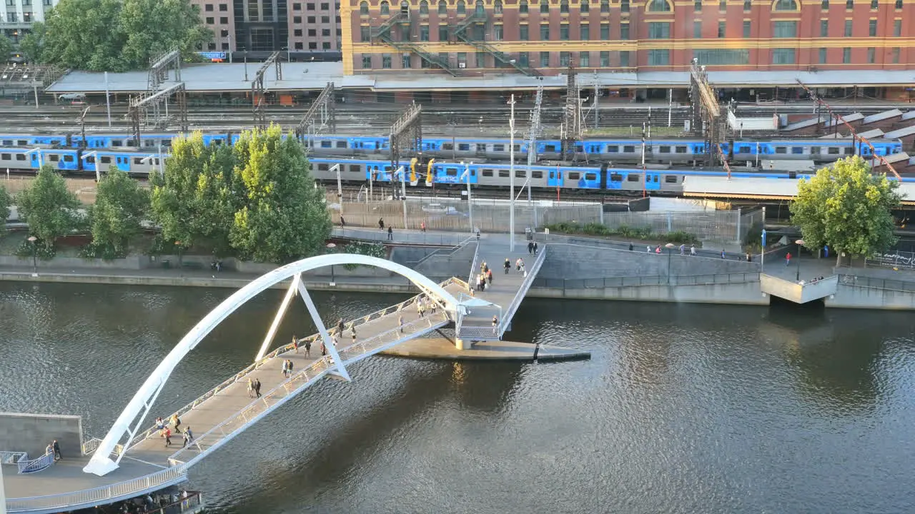 Melbourne Australia foot bridge and passing train