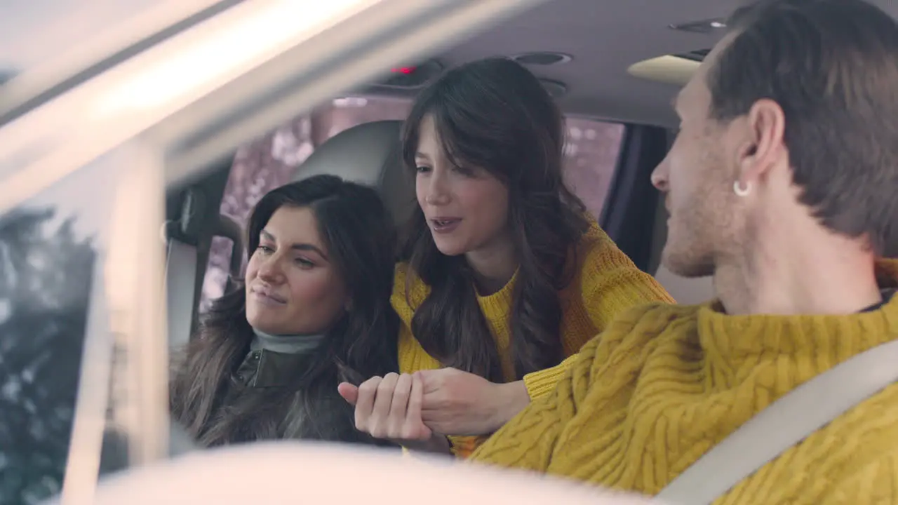 Husband And Wife Sitting In The Front Seats Of A Car 3