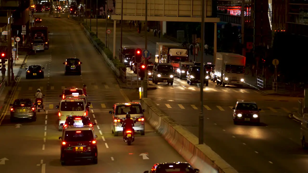 Busy intersection on a road at night in hon Kong City