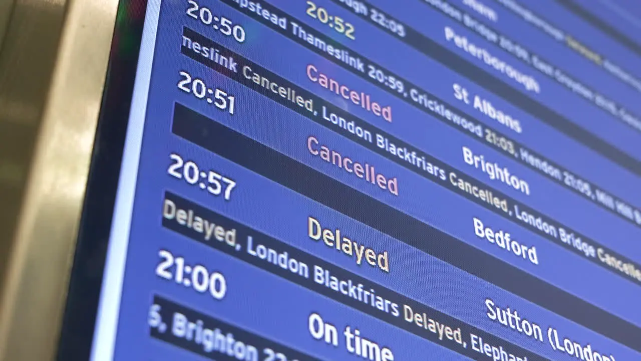 Departure board showing cancelled and delayed train journeys from London St Pancras International station