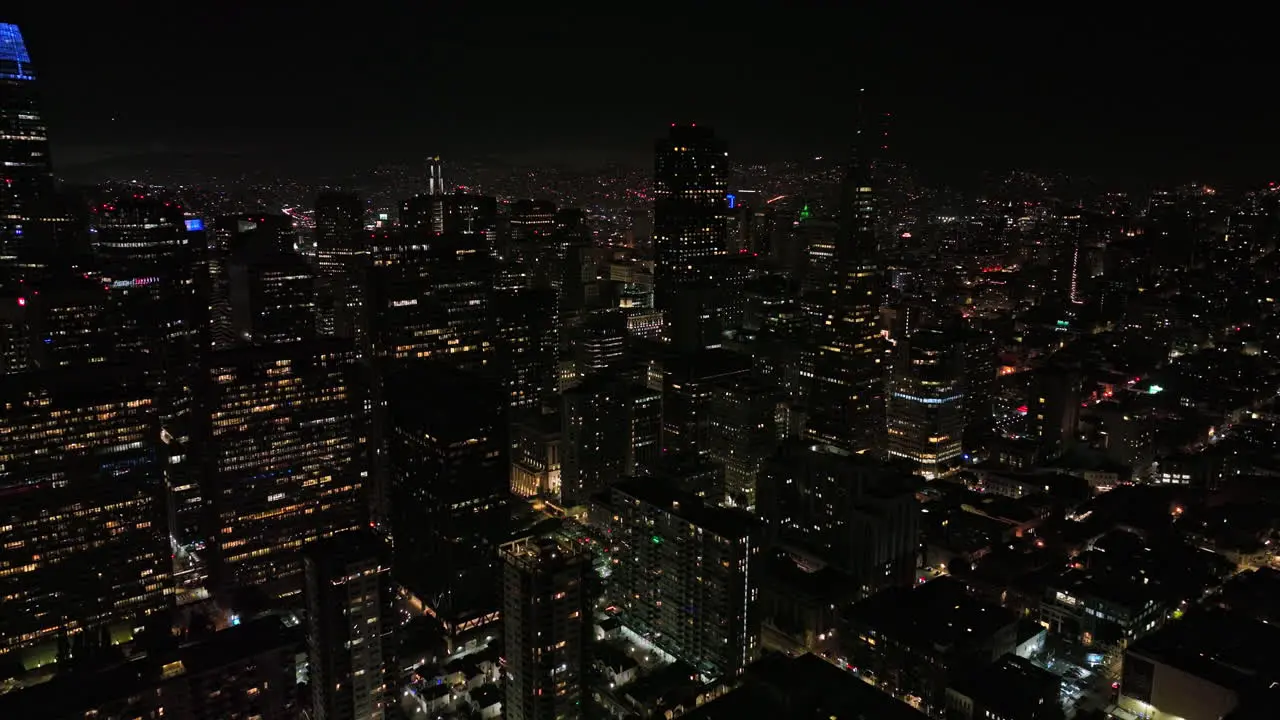 San Francisco California Aerial v133 cinematic flyover densely populated downtown capturing cityscape of illuminated high rise buildings and skyscrapers at night Shot with Mavic 3 Cine May 2022