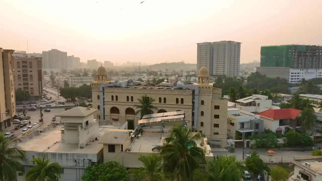 Aerial paralapse shot of city view of Shaheed-e-Millat Road of Karachi during sunset in Pakistan