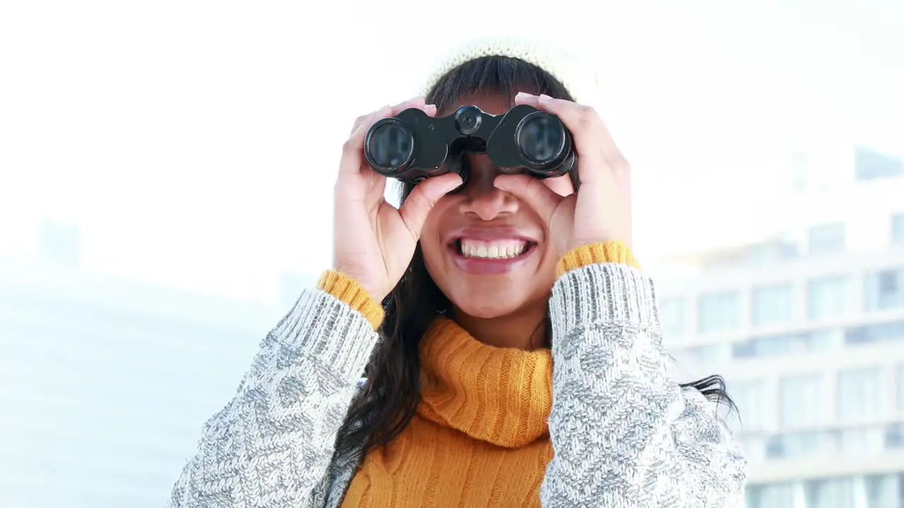 Pretty woman using binoculars