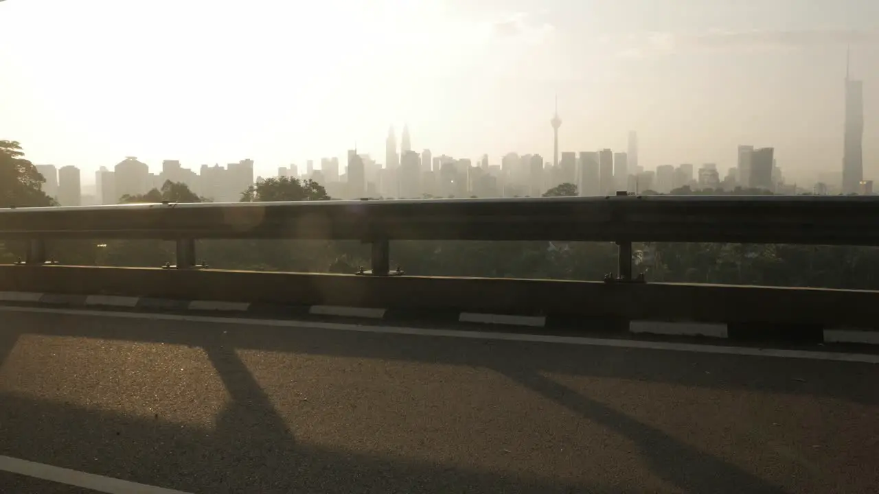 landscape view of kuala lumpur city center downtown district area with many skyscraper building highrise modern style towers with beautiful vanilla sundown sunrise twillight sky KL landscape