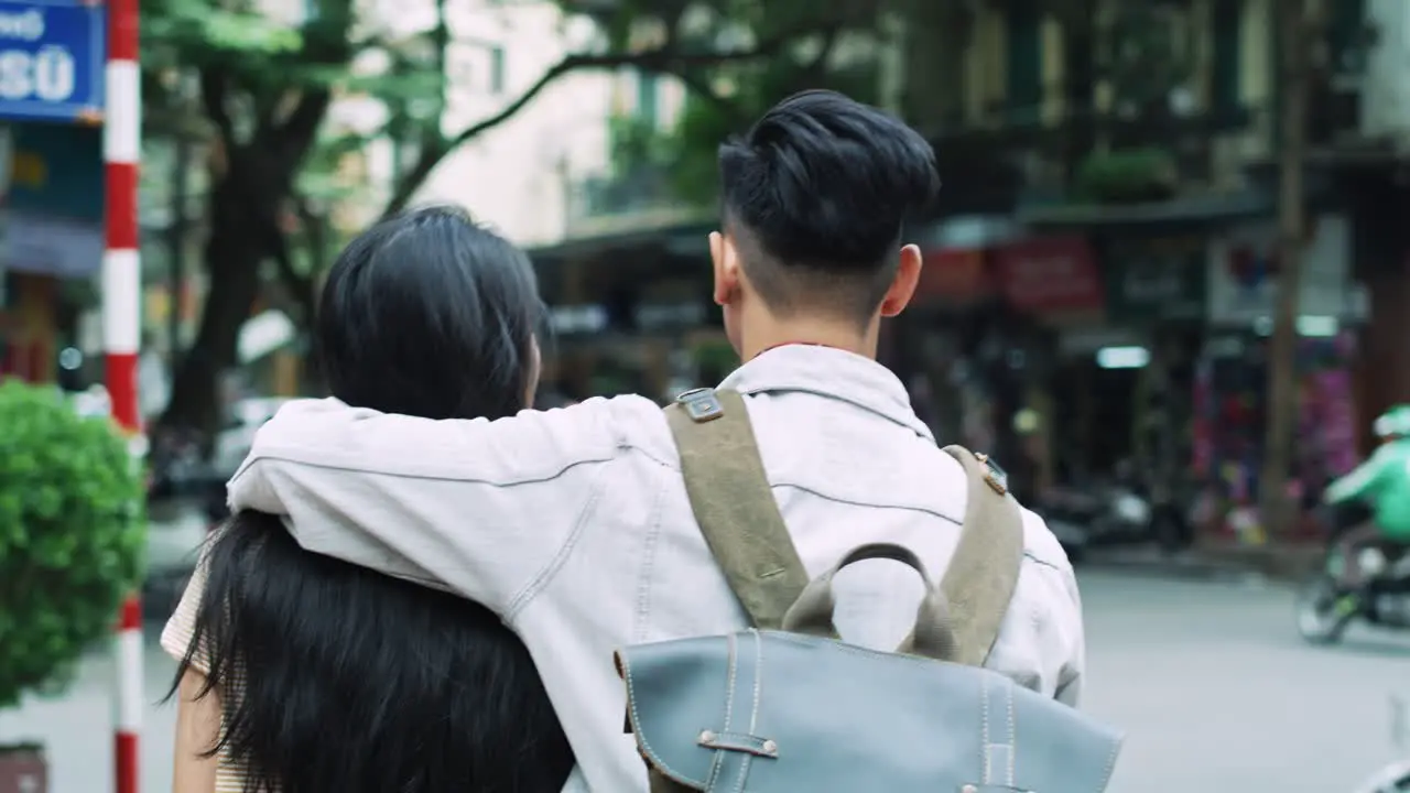 Handheld view of loving couple walking in the Vietnam