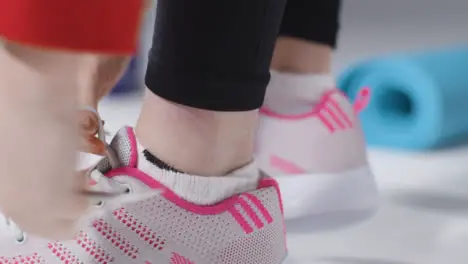 Close Up Shot of Girl Putting on Gym Shoes