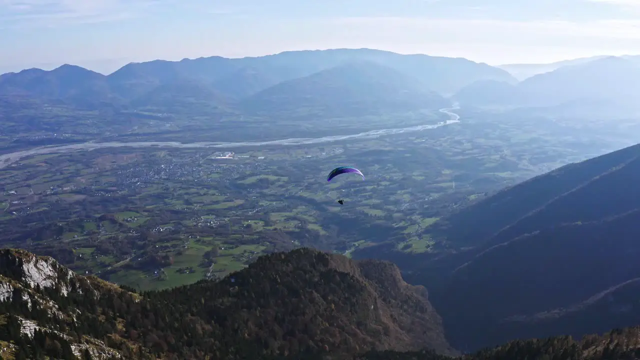 colorful paraglider turn left in the air adventure sport aerial Piave river