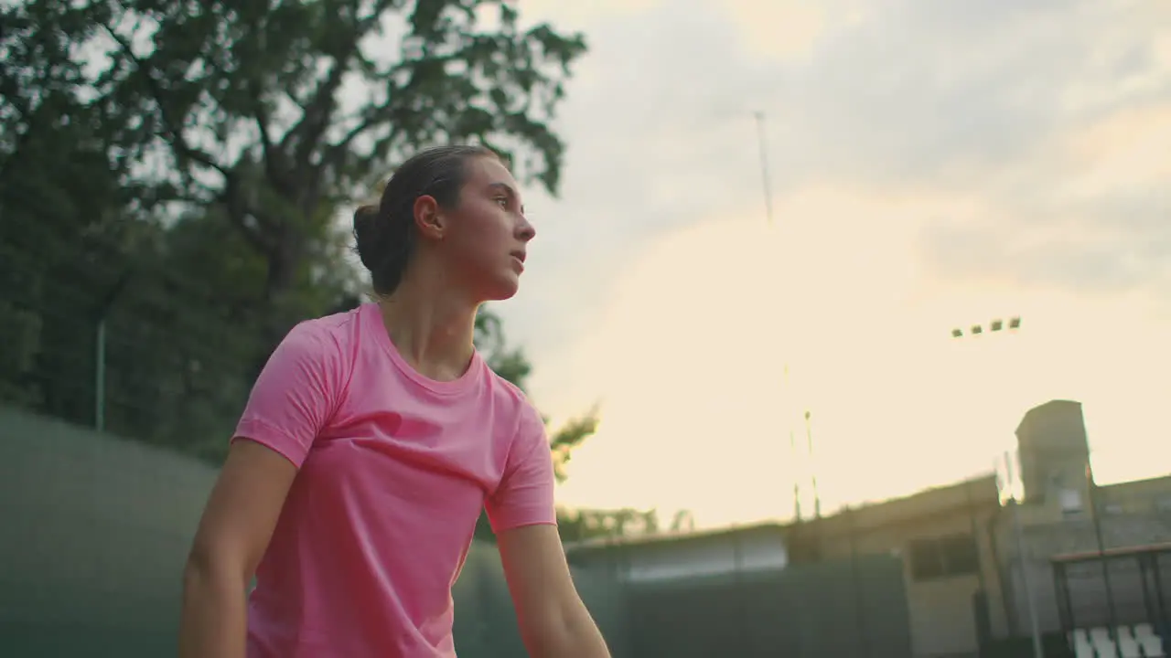 The girl on the central service line repeatedly knocks the ball on the court catches the ball with her hand and serves Medium shot