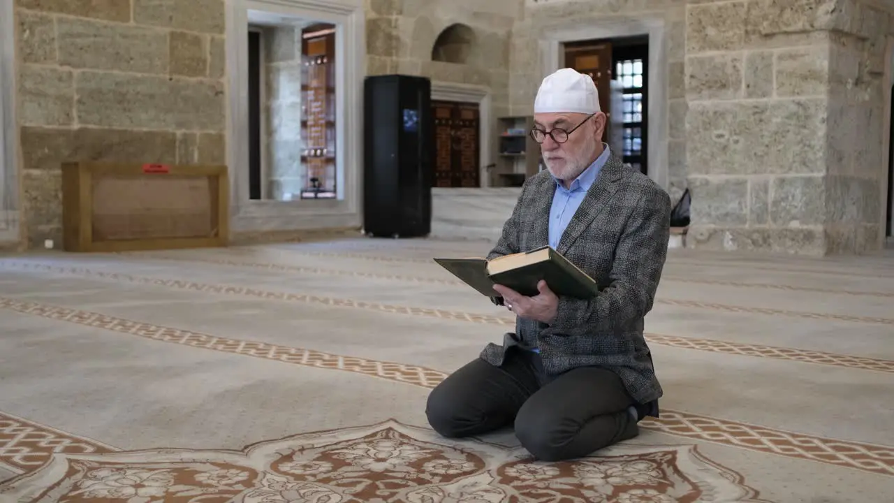 Man reading quran