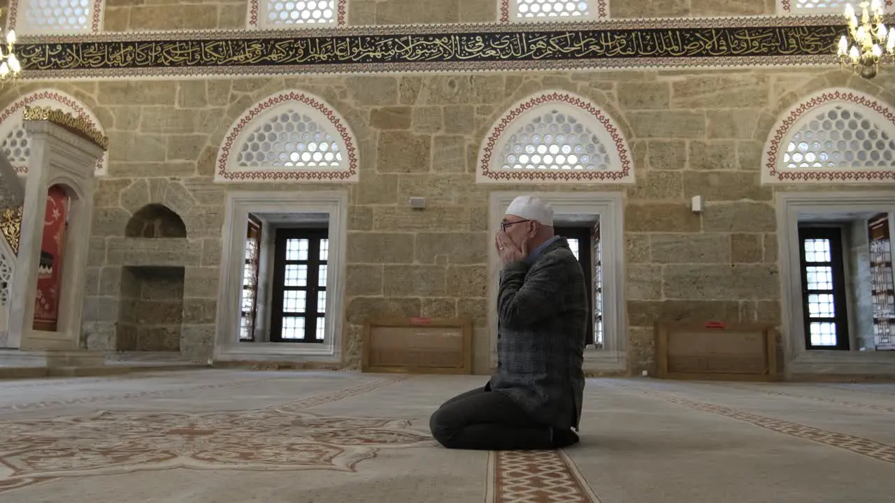 Old man praying with hands