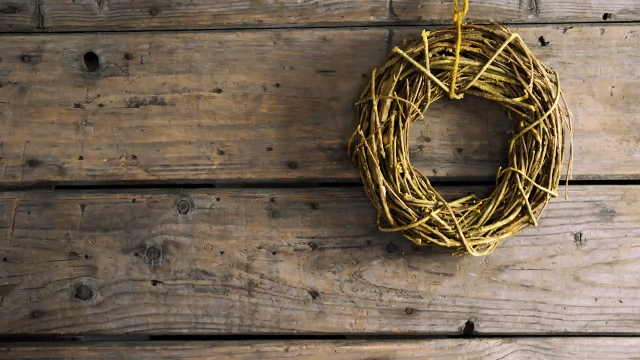 Grapevine wreath on wooden table 4k