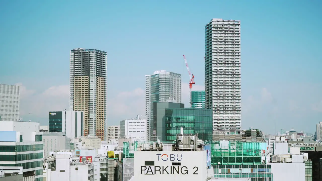 Modern buildings and construction work in Ikebukuro within the Toshima city area of Tokyo Japan