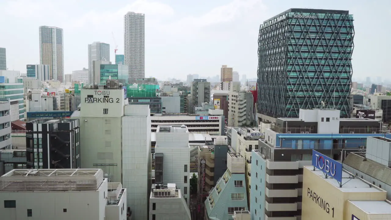 Modern and old buildings in Ikebukuro within the Toshima city area of Tokyo Japan