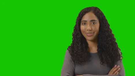 Portrait Of Woman Against Green Screen Smiling At Camera 4