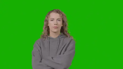 Studio Portrait Of Young Woman With Attitude Against Green Screen 2