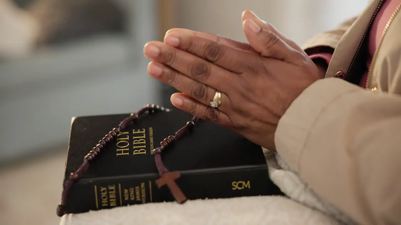 Rosary bible or hands of person praying