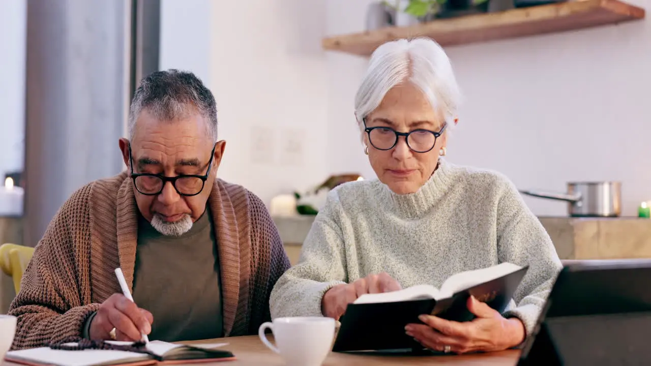 Writing old couple and bible in home for faith