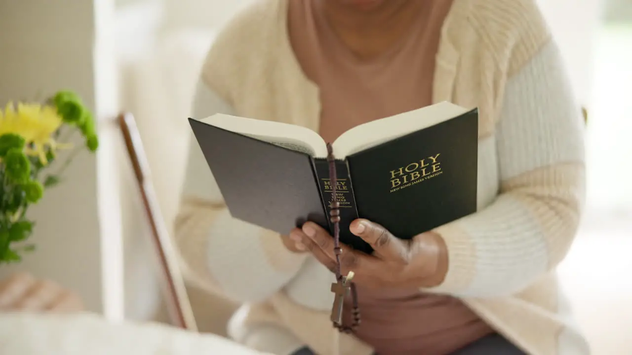 Hands reading and bible study with rosary