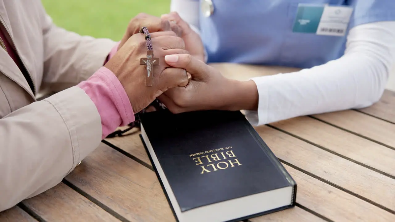 People together and holding hands in prayer