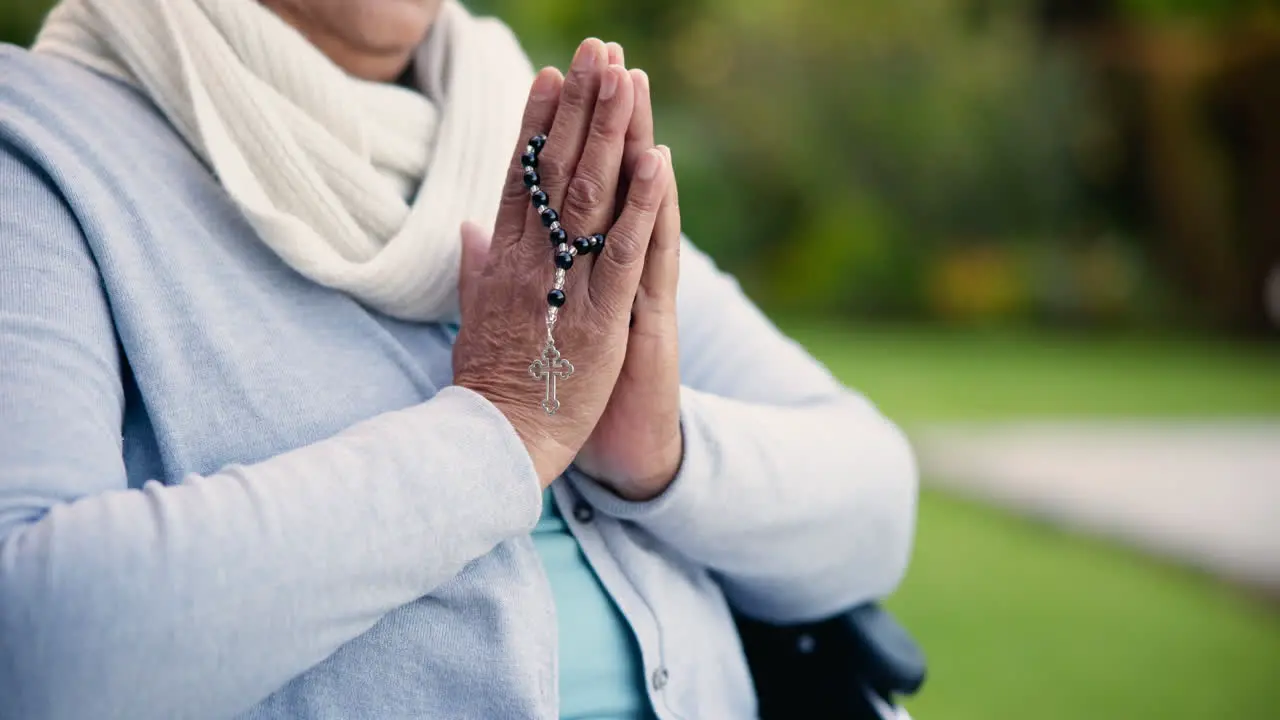 Hands praying with cross and worship