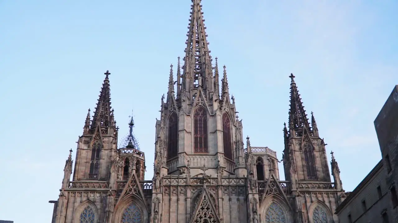 Tilting Up Shot Scenic view of the Gothic Catholic Cathedral In Barcelona Spain Blue Sky In the background