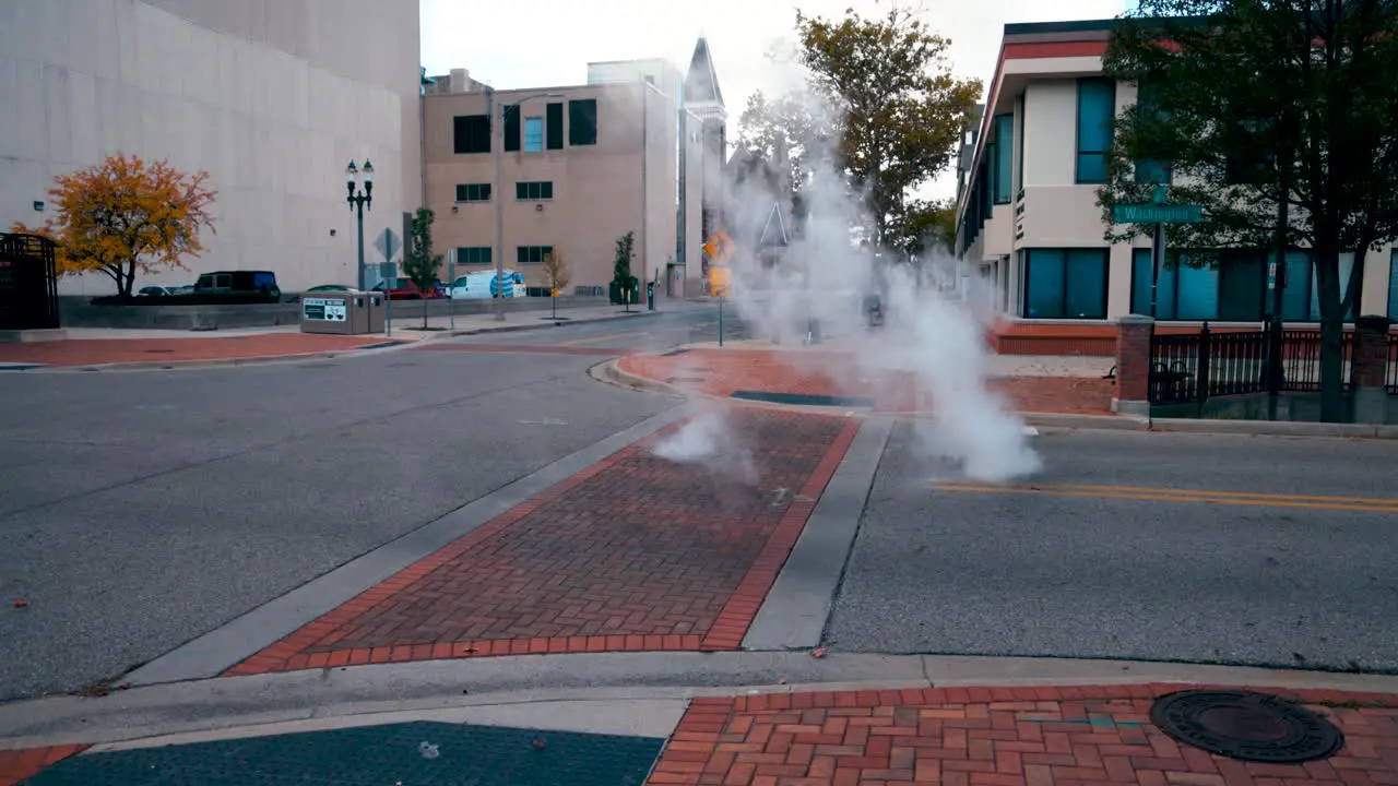 Steam rising from below a city street in Lansing Michigan