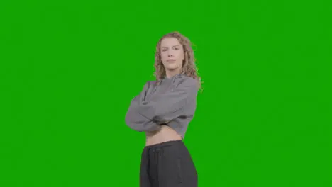 Studio Portrait Of Young Woman With Attitude Against Green Screen 1